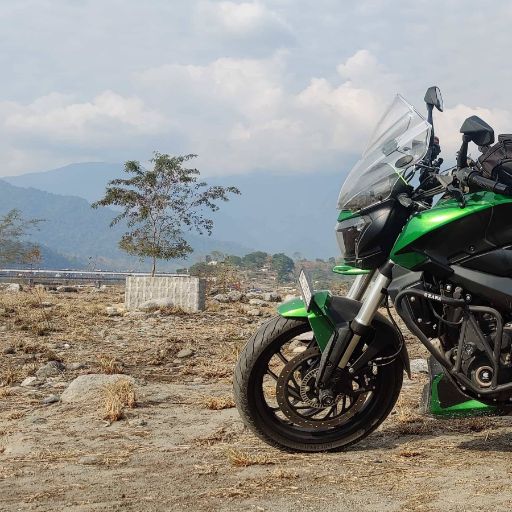 Somewhere in the Bhutan foot hills, a quick break to soak in the view and to rest my aching back.