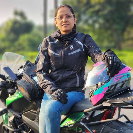 My trusty companion parked by the roadside with a backdrop of rolling hills and misty clouds in the Khasi region