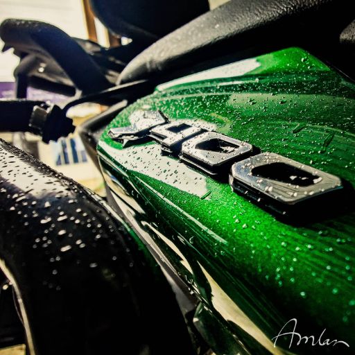 A quick wash for the bike at a roadside stop.